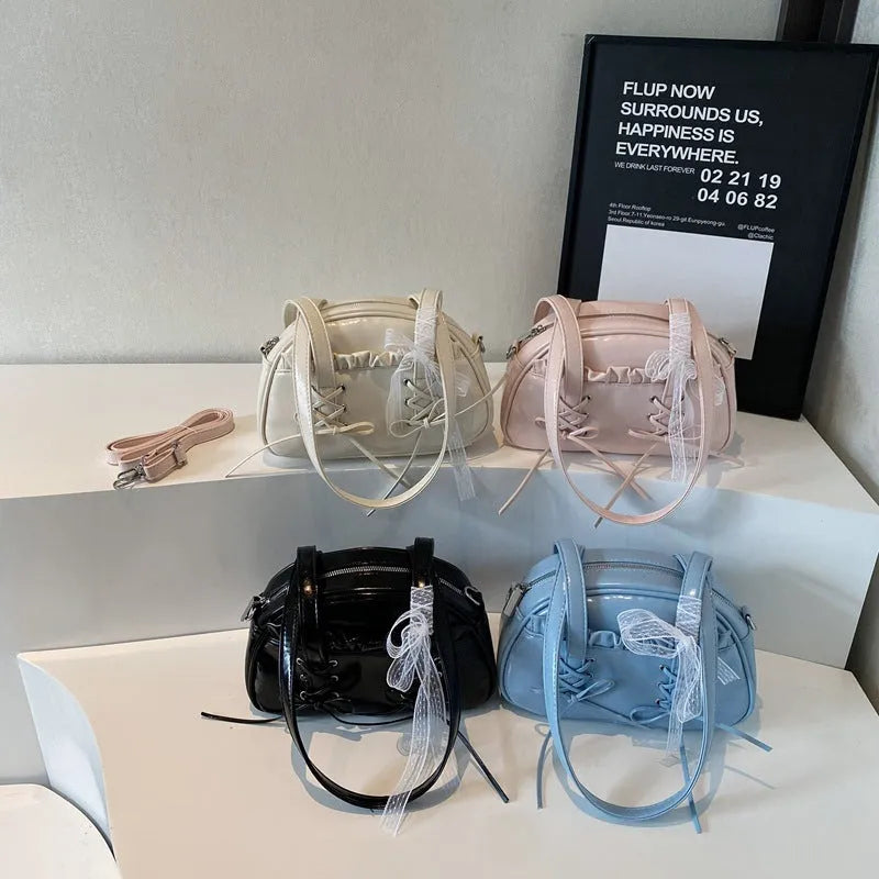 Women's casual PU leather handbag with a bandage bow decoration on the front.