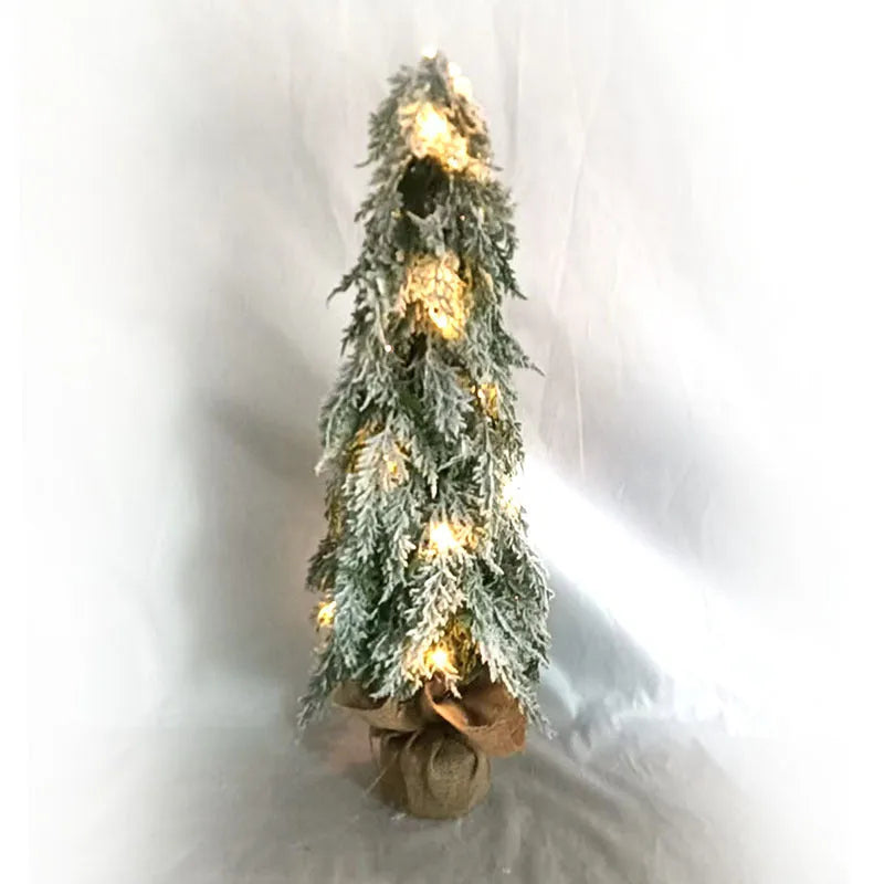 Small 24-inch desktop artificial Christmas tree with white snow sprayer effect and integrated coloured lights