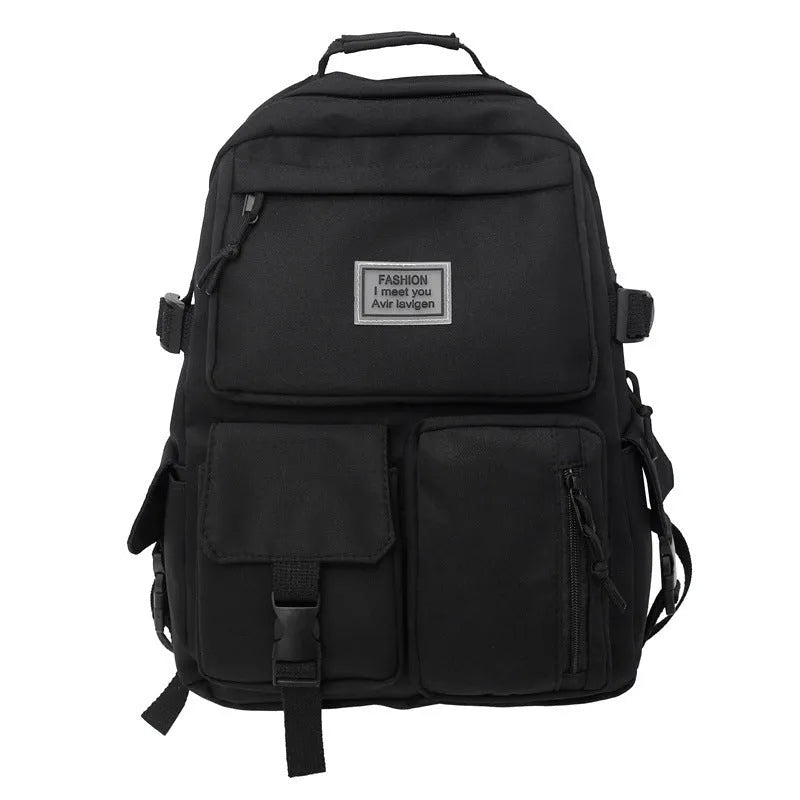 Black and white soft nylon student backpack showing external pockets and internal laptop compartment.