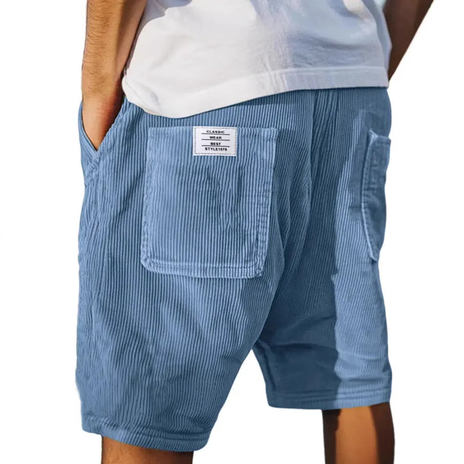 Men's grey corduroy shorts showing multiple pockets and embroidery detail on straight-leg design