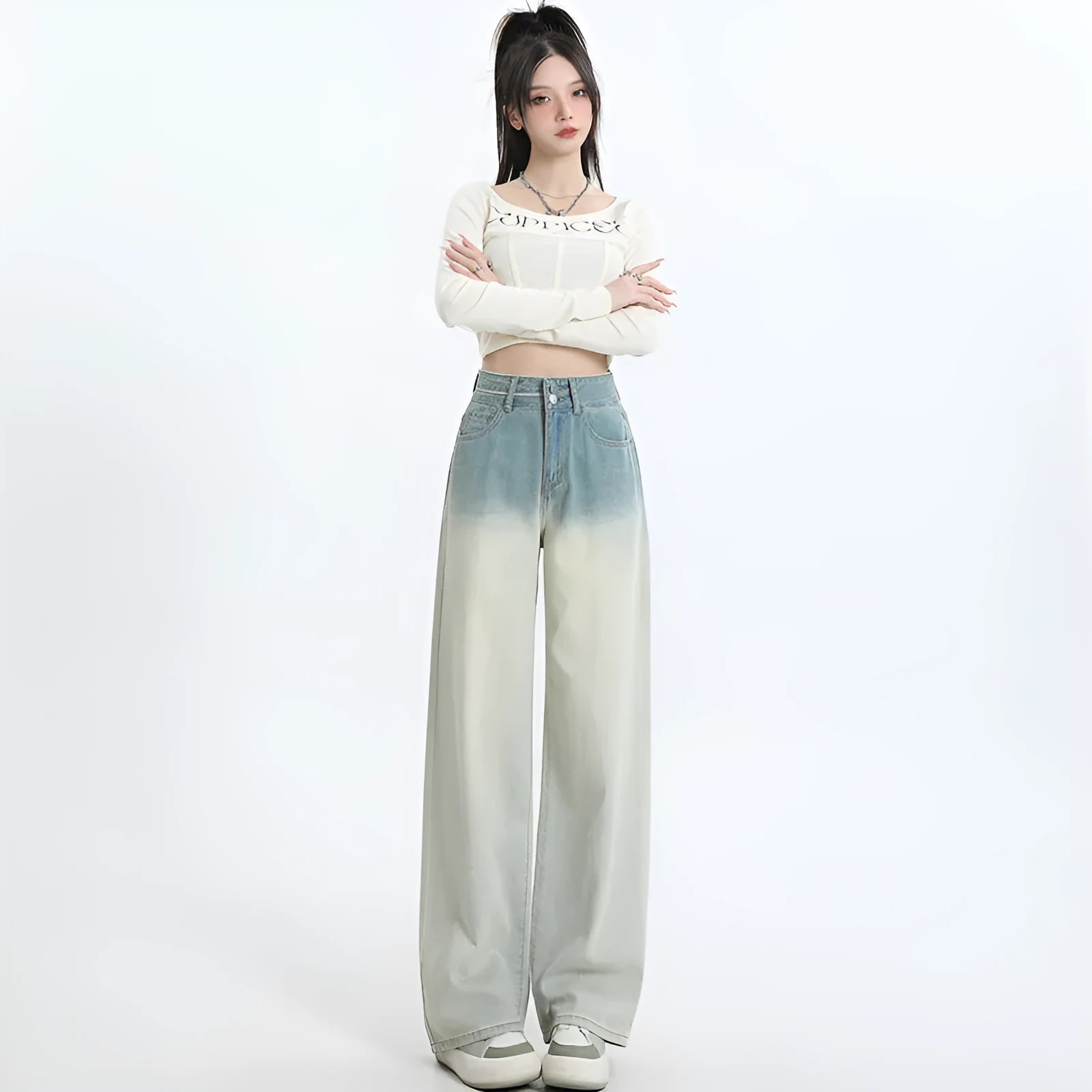 Women's gradient blue straight-leg denim trousers showing wider cut through thigh and calf