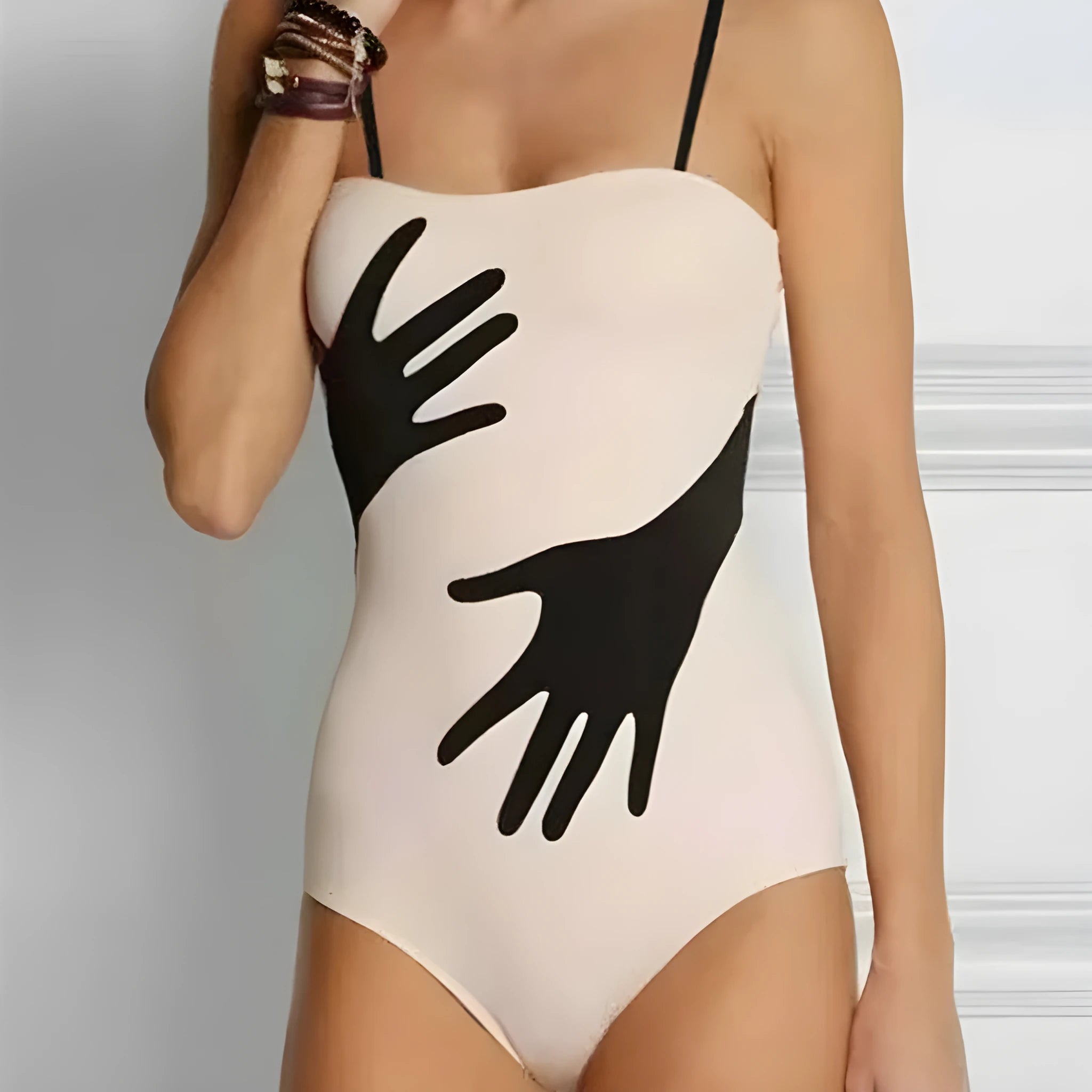 A women's one-piece bikini swimsuit with a gauze skirt, shown in a colour option.