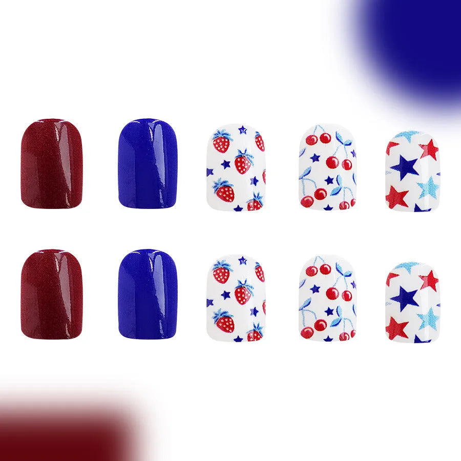 Short glossy red and blue nail stickers with strawberry and cherry patterns - 24 piece set