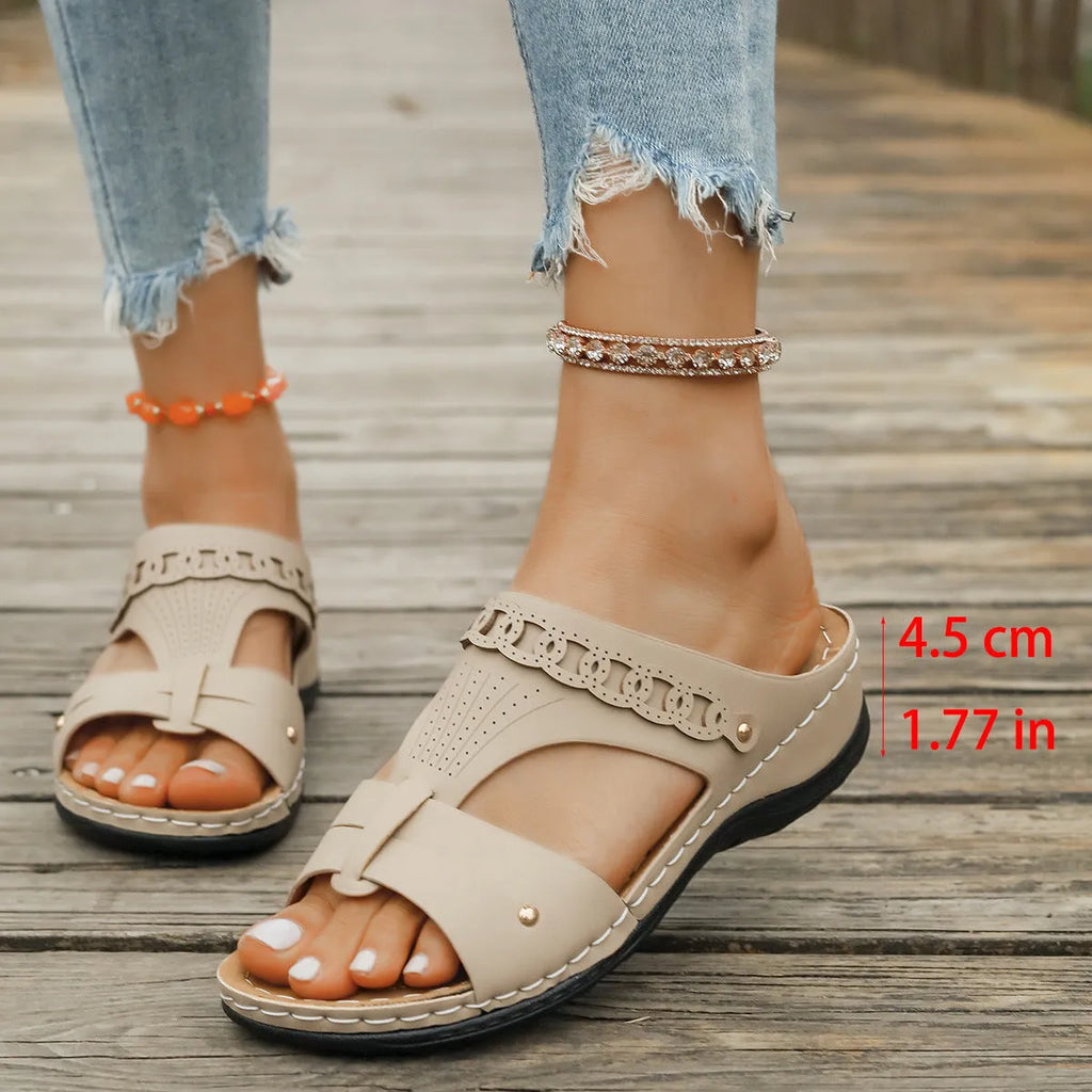 Casual slope heel roman style slippers in blue with fish mouth toe design and rubber sole.