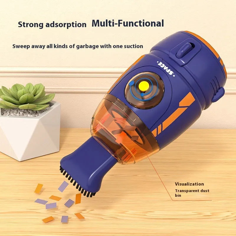 Blue USB rechargeable handheld desktop vacuum cleaner on a wooden desk next to a keyboard