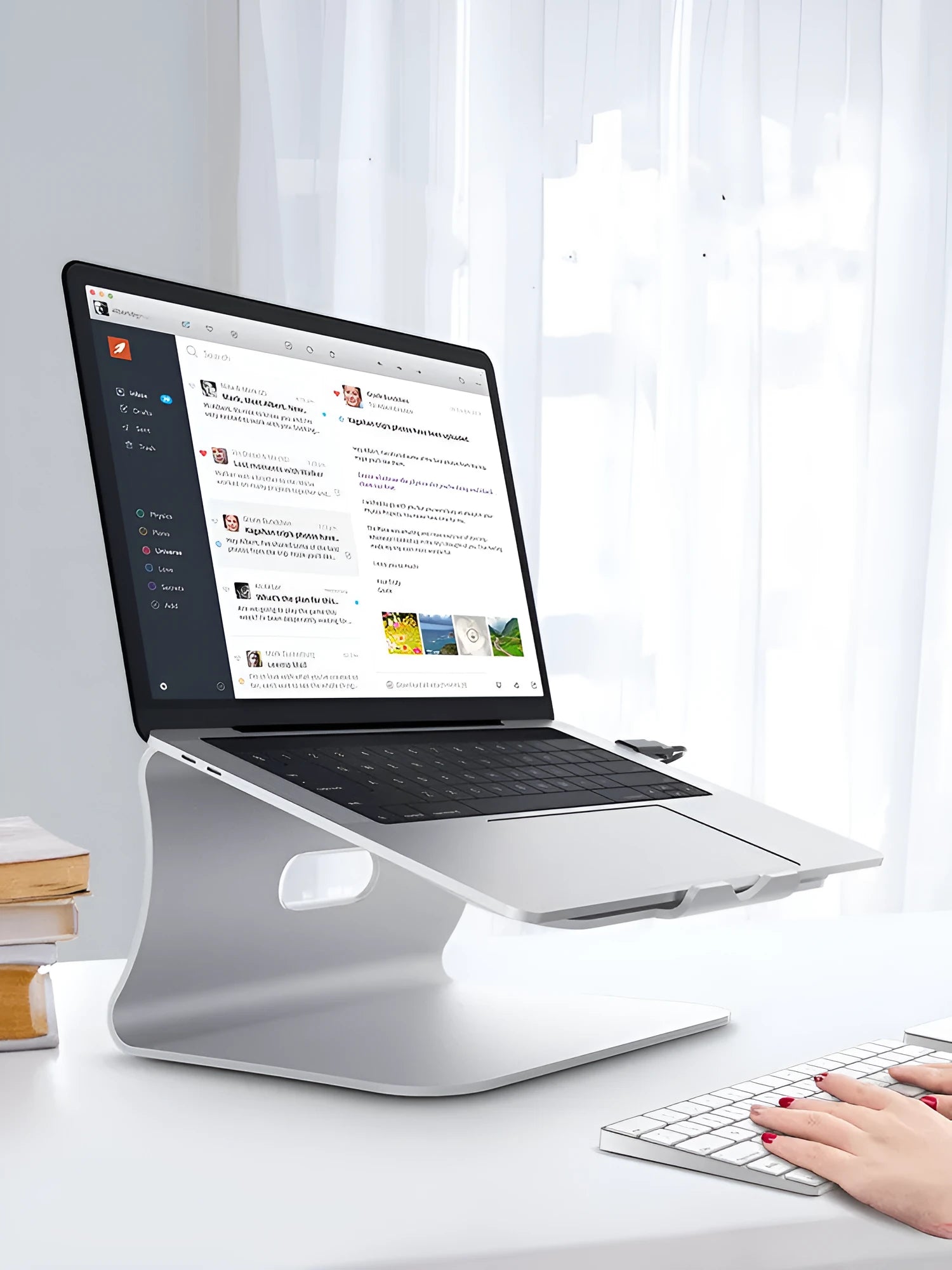 Aluminium laptop cooling bracket in silver colour with rotating base design.