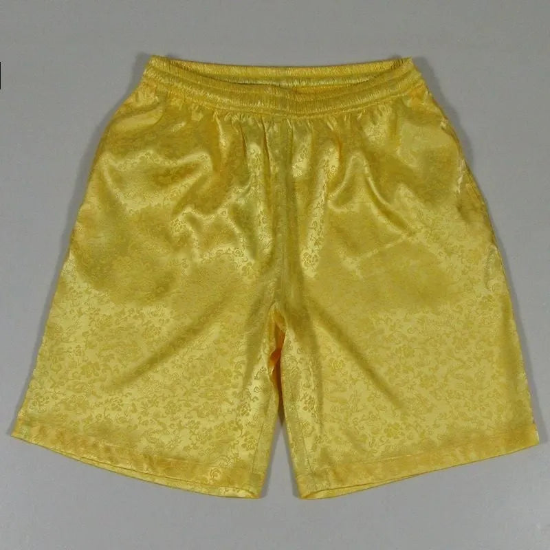 Men's black Tang suit style Tai Chi shorts with an elastic drawstring waistband.