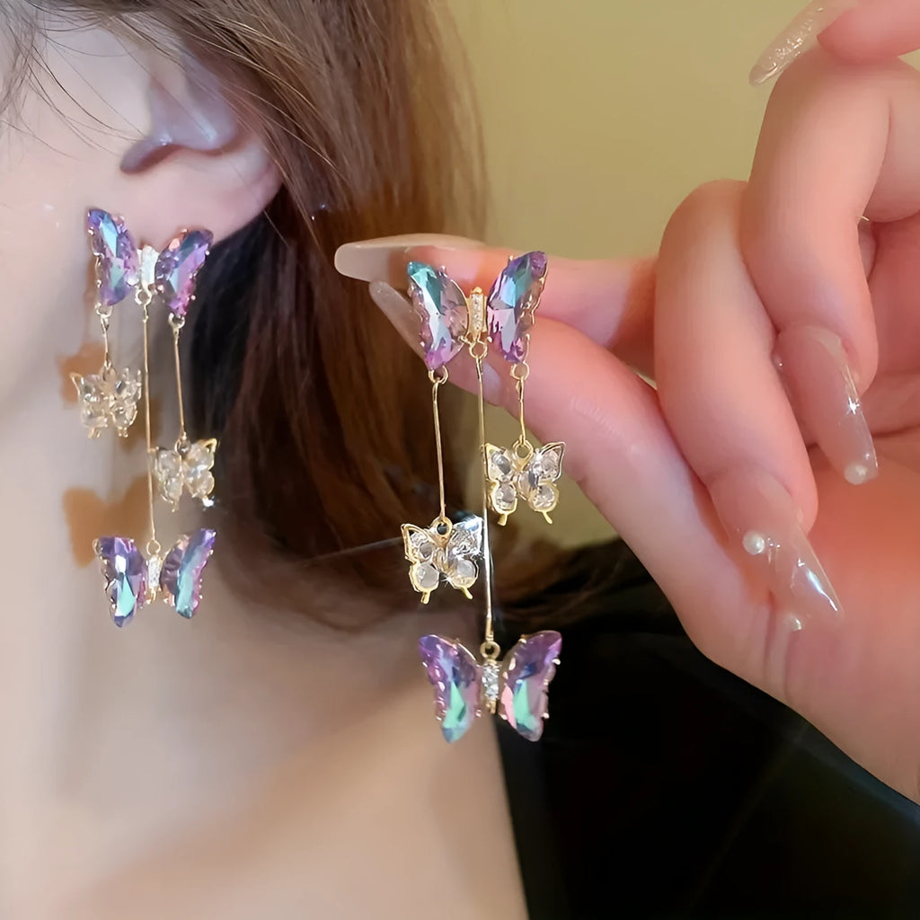 Silver needle finish blue purple butterfly and crystal flower drop tassel earrings for women.