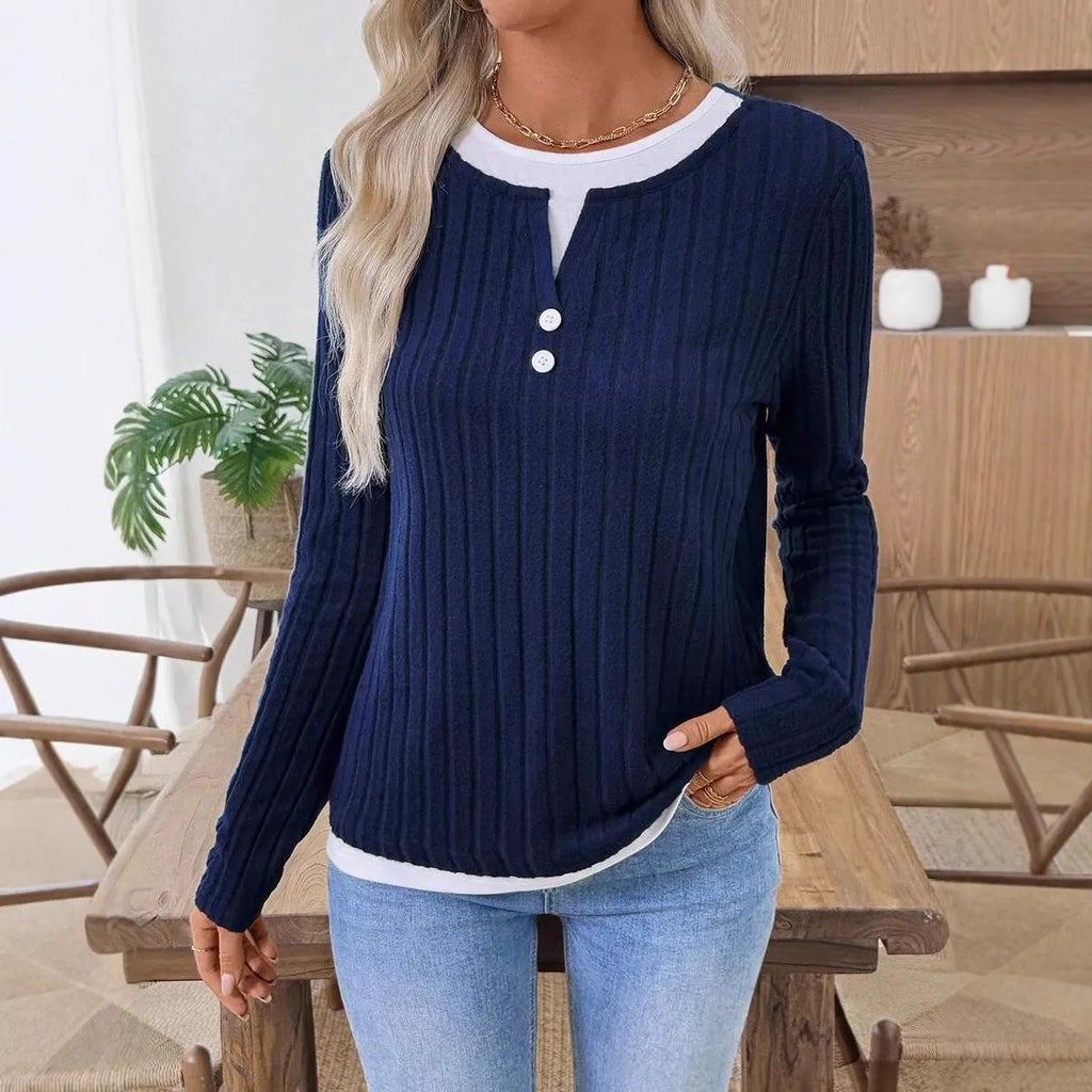 Women's black fake two-piece pullover sweater with round neck and button detail on concave stripe fabric