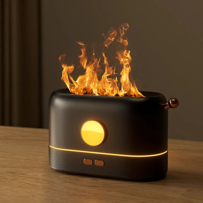 Black USB humidifier with flickering flame effect and water tank on wooden desktop