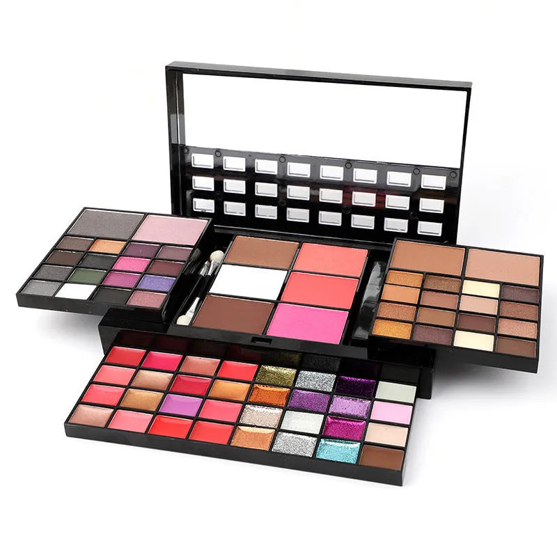 74 colour makeup palette open showing eyeshadows, lip glosses, and face powders with brushes