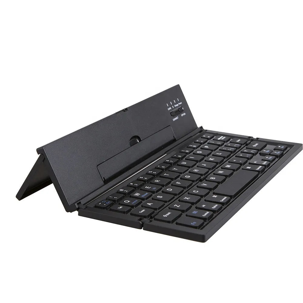 Black foldable ultra-thin wireless Bluetooth keyboard for tablets shown open next to a mobile phone.