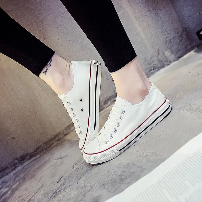 Women's solid colour canvas casual flat shoes showing available colour options and size range
