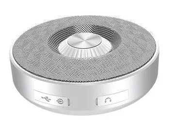 Compact black portable Bluetooth speaker on a table, showing its small size and design.