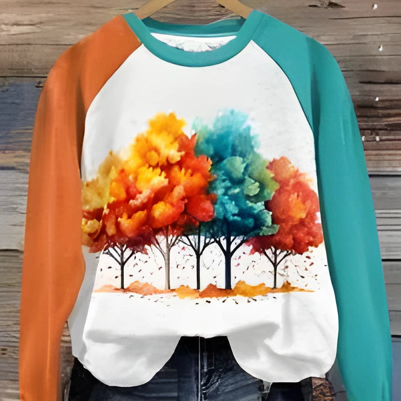 Green women's hoodie with a raised 3D cartoon character print on the front, long sleeves.