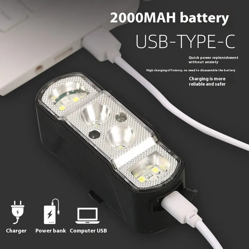 Black bicycle headlight with 350 lumen output and rechargeable battery mounted on handlebars