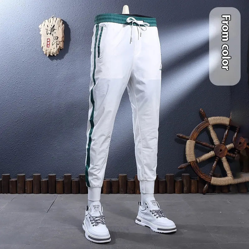 Ice silk breathable stretch slim-fit ankle-tied skinny sports trousers for men, black stripe design