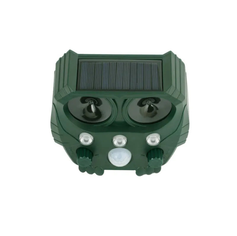 Green solar-powered ultrasonic dog and pest repeller unit for outdoor mounting