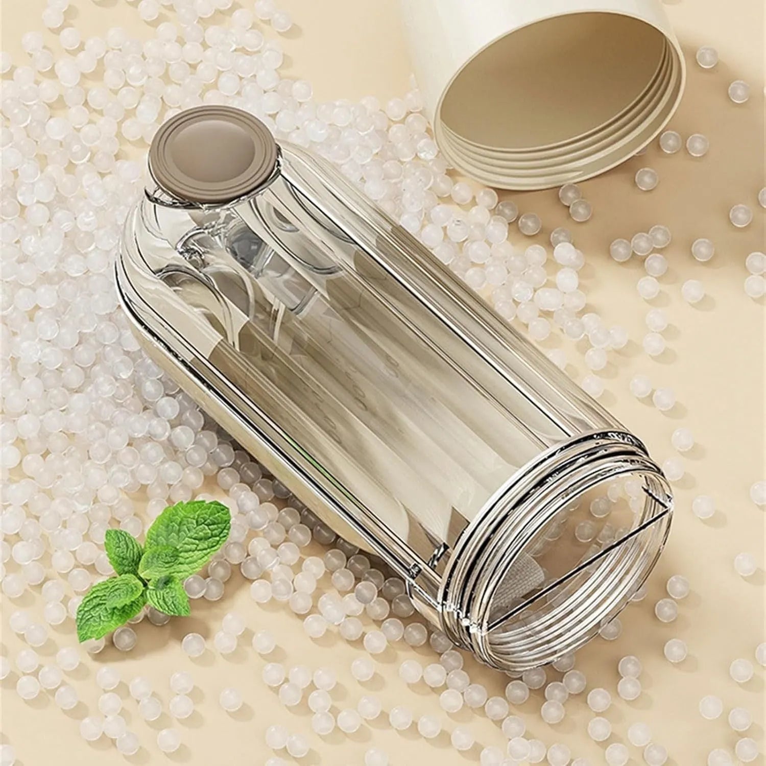 Foldable beige dog water bottle with food dispenser tray extended for drinking outdoors