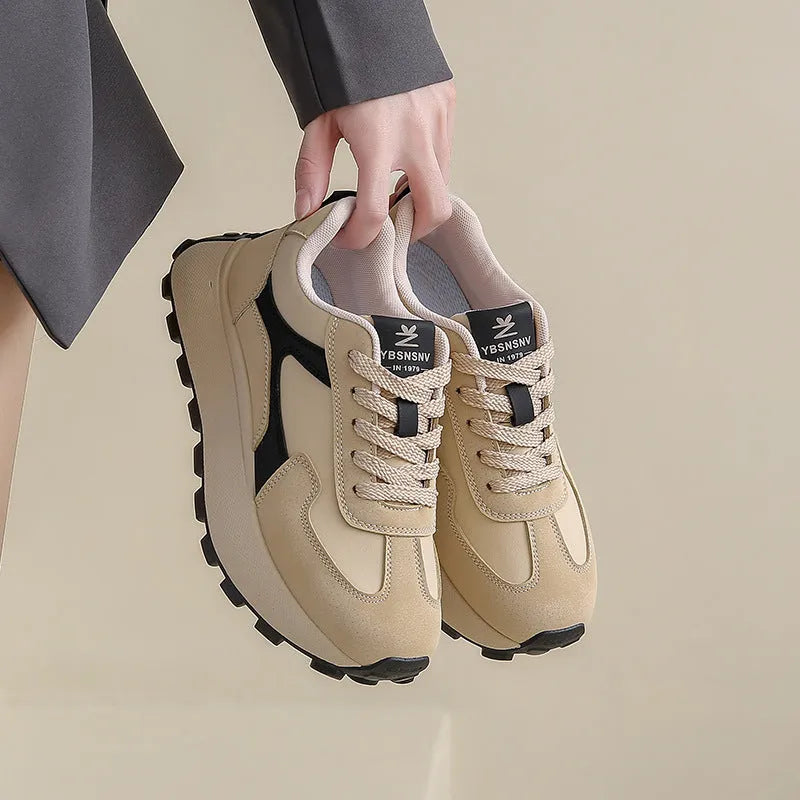 Women's low-top platform sports running shoes in solid colours with flat rubber sole and lace-up front.