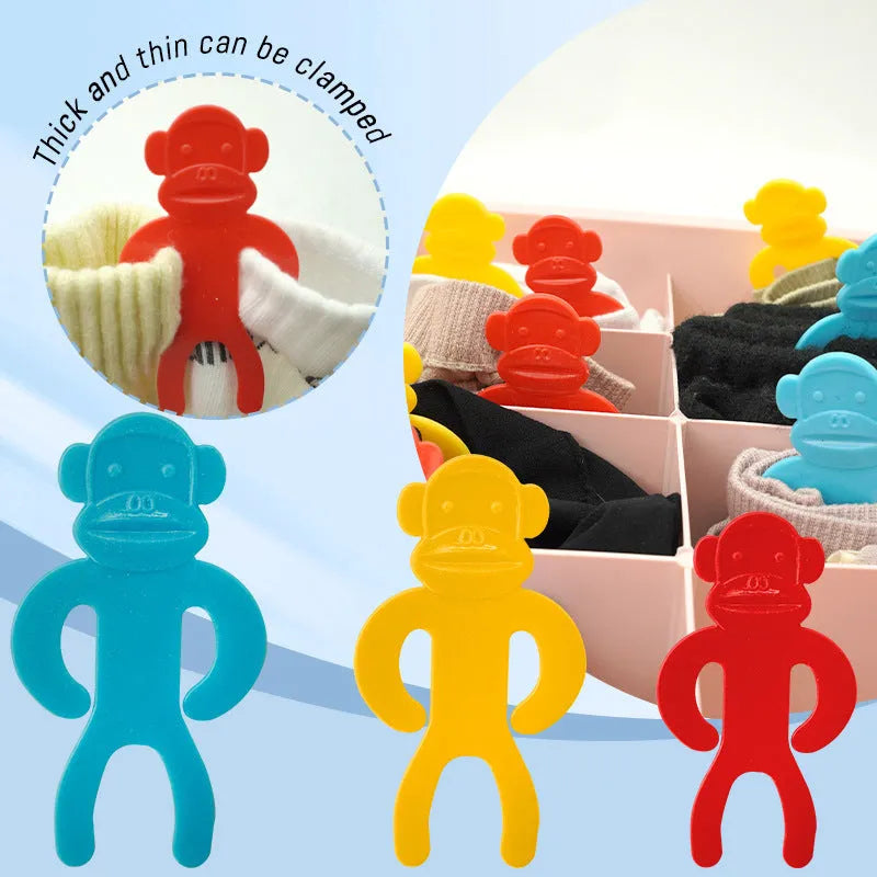 Plastic sock storage clips in blue, yellow, and red colours for laundry organisation