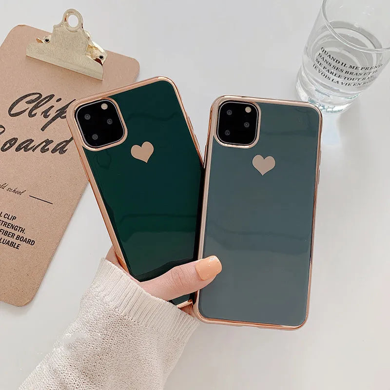 Slim TPU iPhone case in a solid colour with a luxury plating love design, shown fitted to a phone.