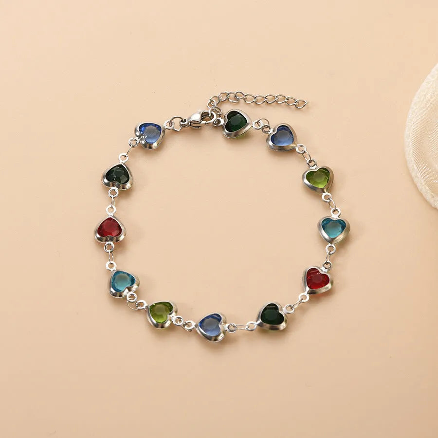 Devil's Eye Creative All-match Fashion Heart Bracelet in stainless steel on a wrist.