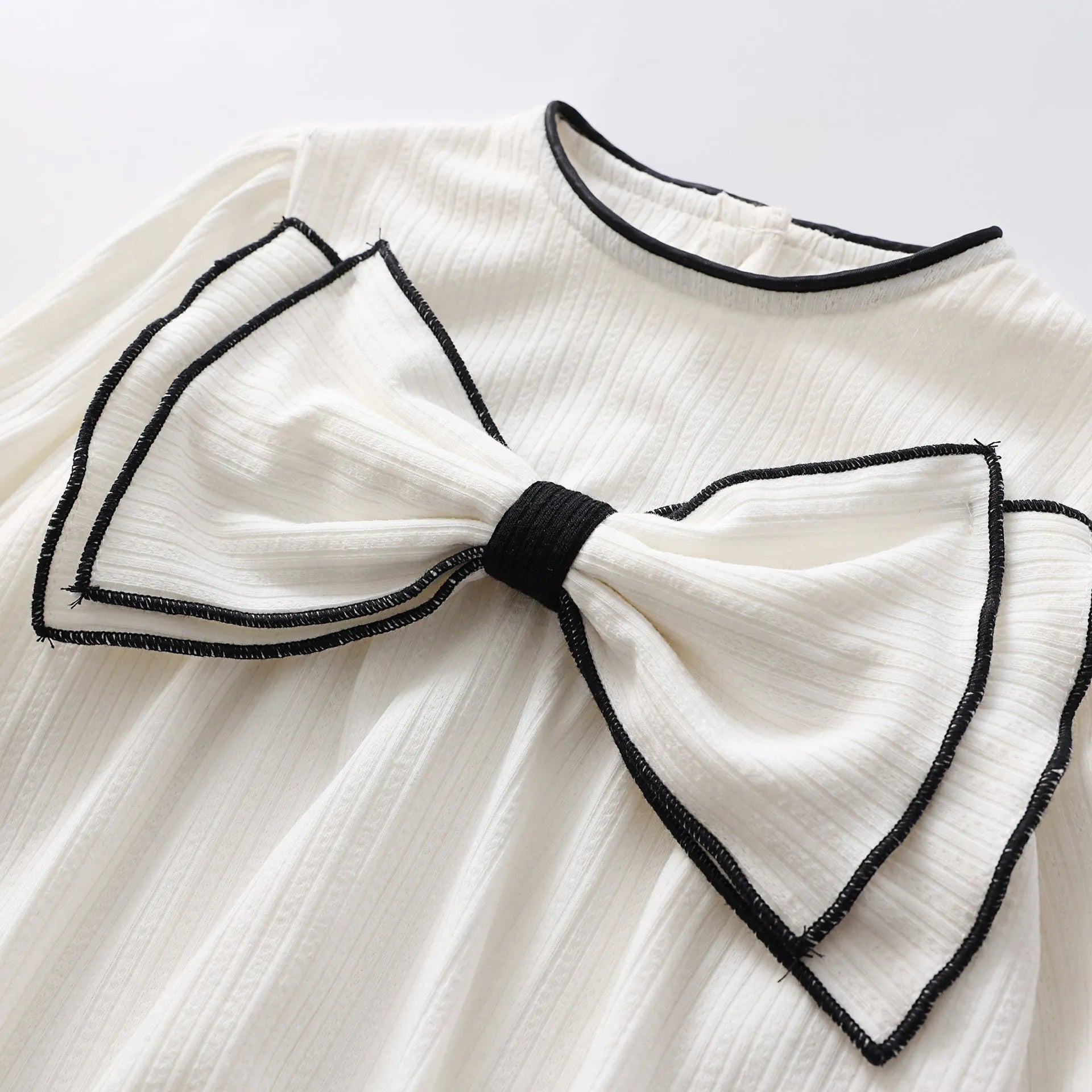 Baby girl long sleeve cotton onesie with bow detail in white triangle style