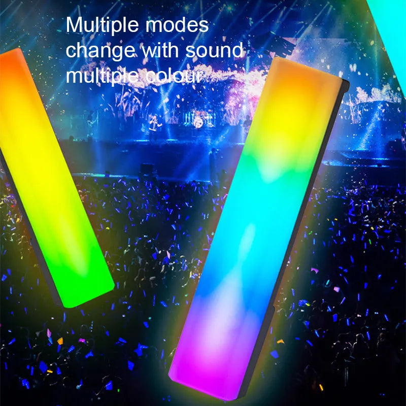 Black and white 3D RGB voice-activated music rhythm ambiance lamp on a table.