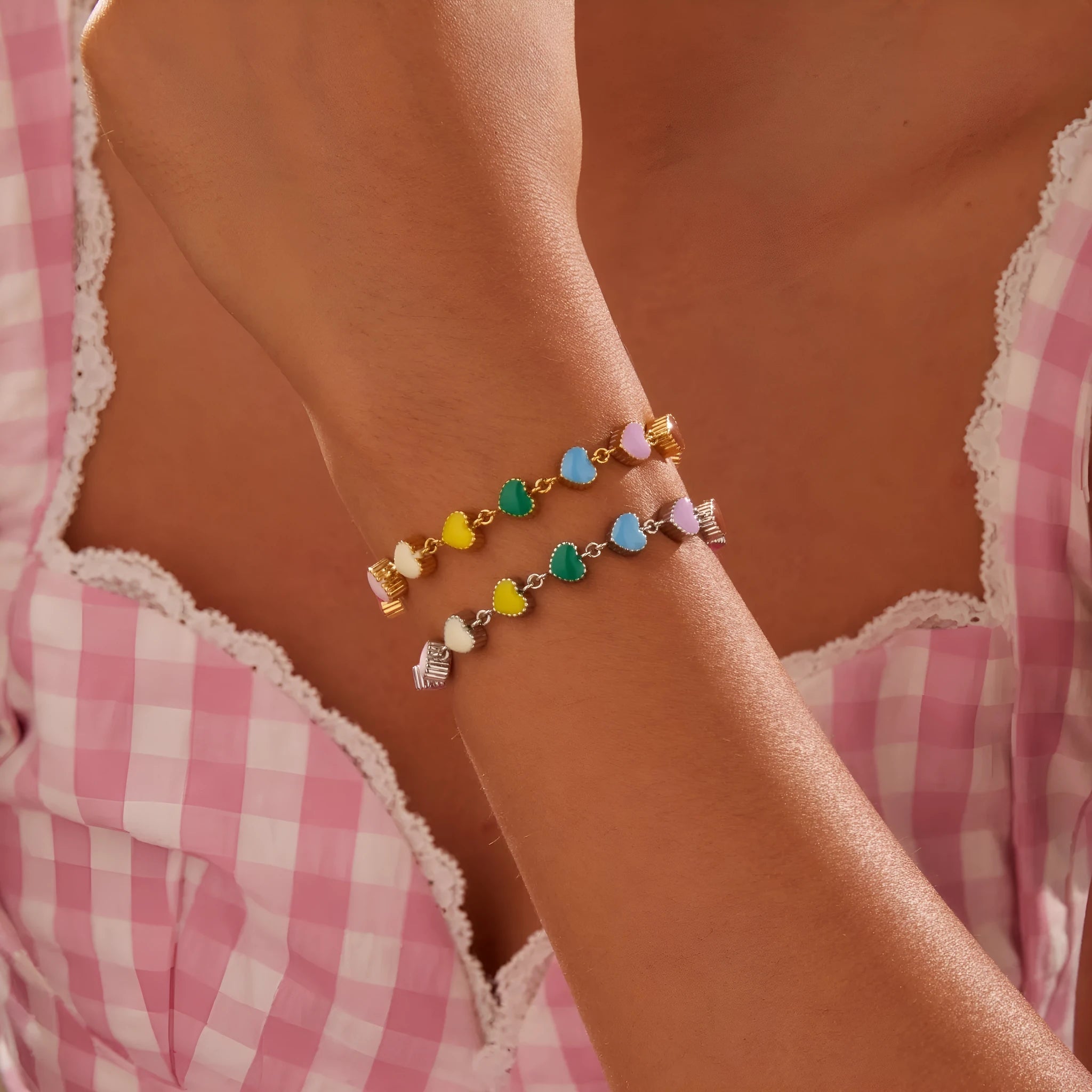 Gold or steel tone stainless steel love heart pendant bracelet for women.