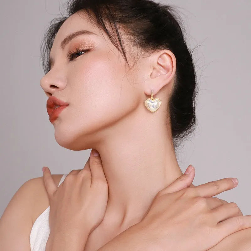 Gold colour clip-on earrings for women with metal alloy construction and natural summer style design
