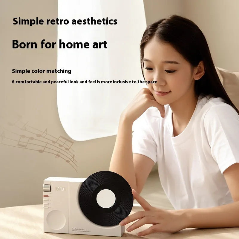 Mini Bluetooth speaker in obsidian black, ivory white, coral pink, and plum green colours