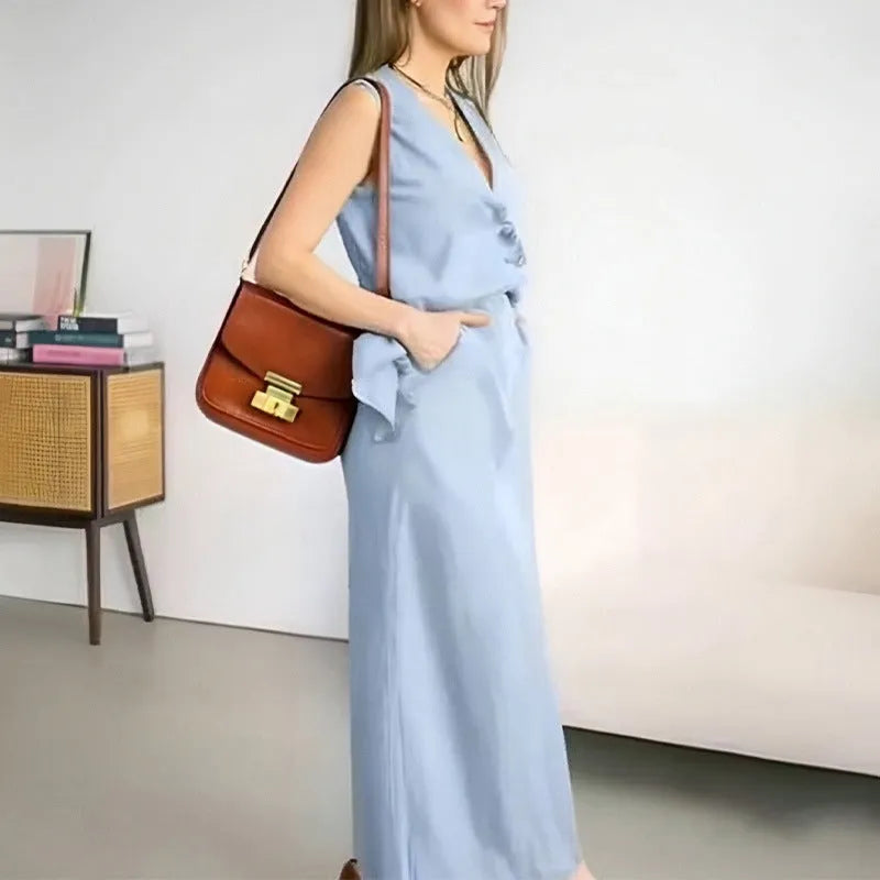 Women's casual two-piece outfit with a sleeveless loose vest and a long flowing skirt on a hanger.