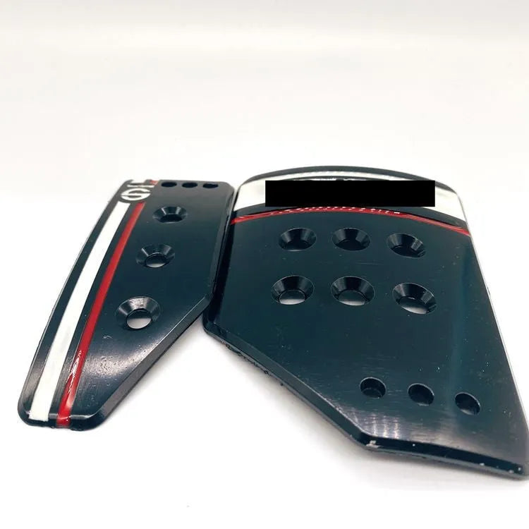 Aluminium alloy manual transmission car pedal set in grey or black with brake, accelerator, and clutch pedals.