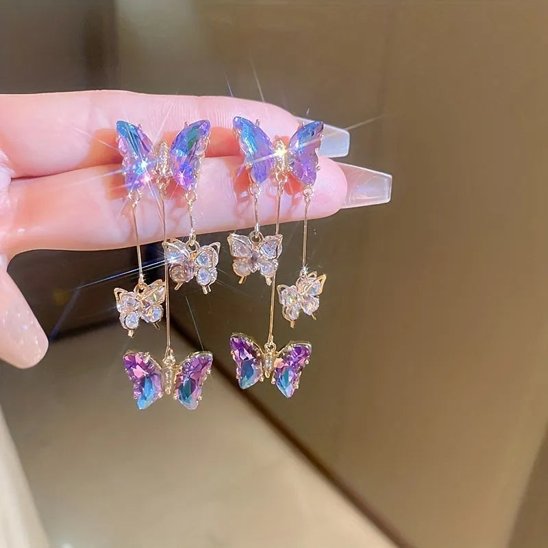Silver needle finish blue purple butterfly and crystal flower drop tassel earrings for women.