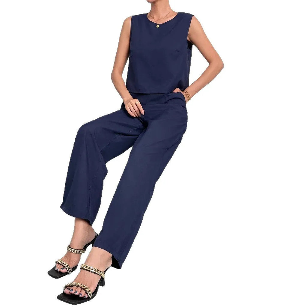 Red sleeveless round neck top with matching wide leg trousers two-piece set