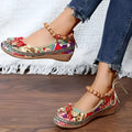 Women's black ethnic platform sandals with cloth upper and elastic band fastening on a white background.