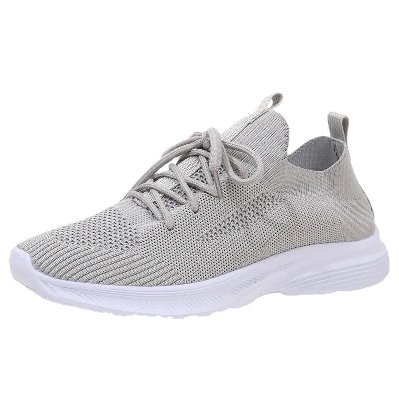 Women's low-top mesh breathable tennis shoes in creamy white, orange, and gray colours.