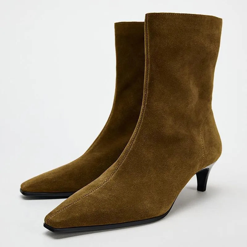 Brown women's retro ankle boots with a square toe, side zip, and a mid-height stiletto heel on a white background.