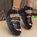 Black outdoor beach sandals with thick rubber sole and adjustable strap buckle closure