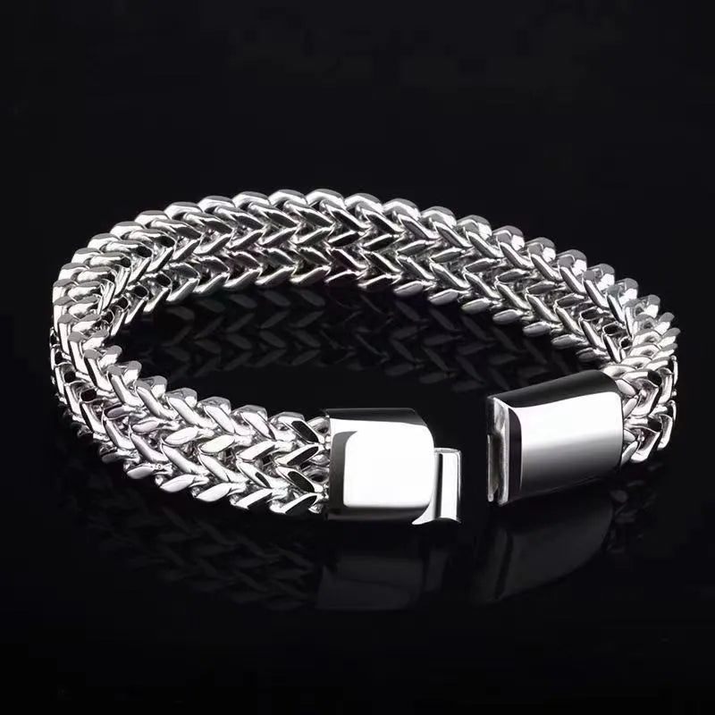 Silver titanium steel men's bracelet with geometric links on a wrist
