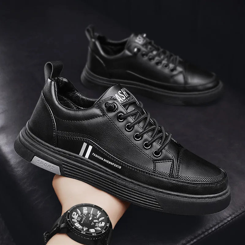 Men's low-top skate shoes in black with microfiber upper, rubber sole, and elastic band.