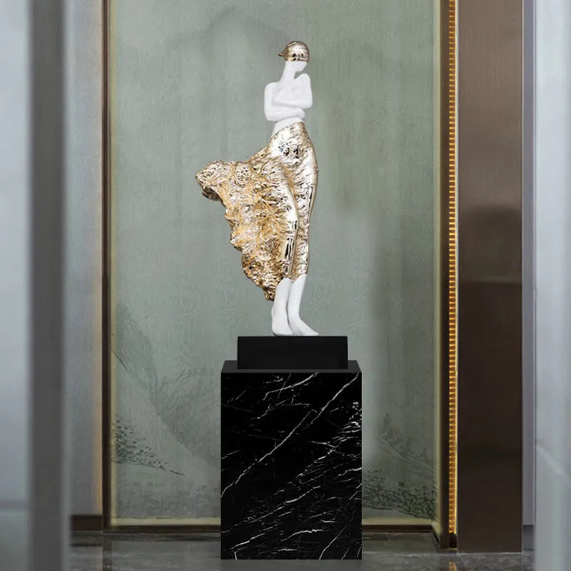 A tall, modern sculptured character ornament in a rose gold metallic finish, standing 48cm high.