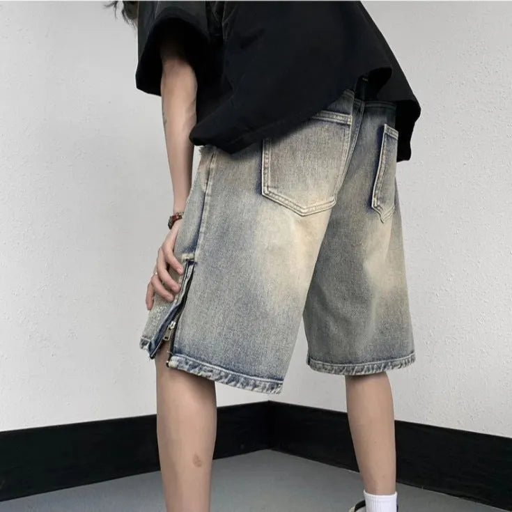 Blue retro denim shorts with a wide-leg loose fit and tattered detailing on a mannequin.