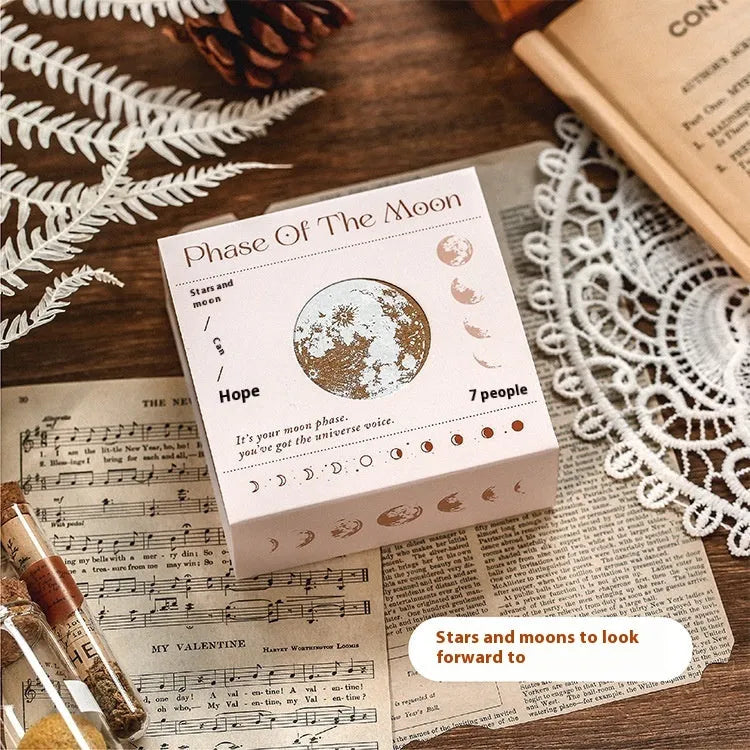 Wooden decorative stamp set with seven hand-carved botanical or celestial designs for paper crafts
