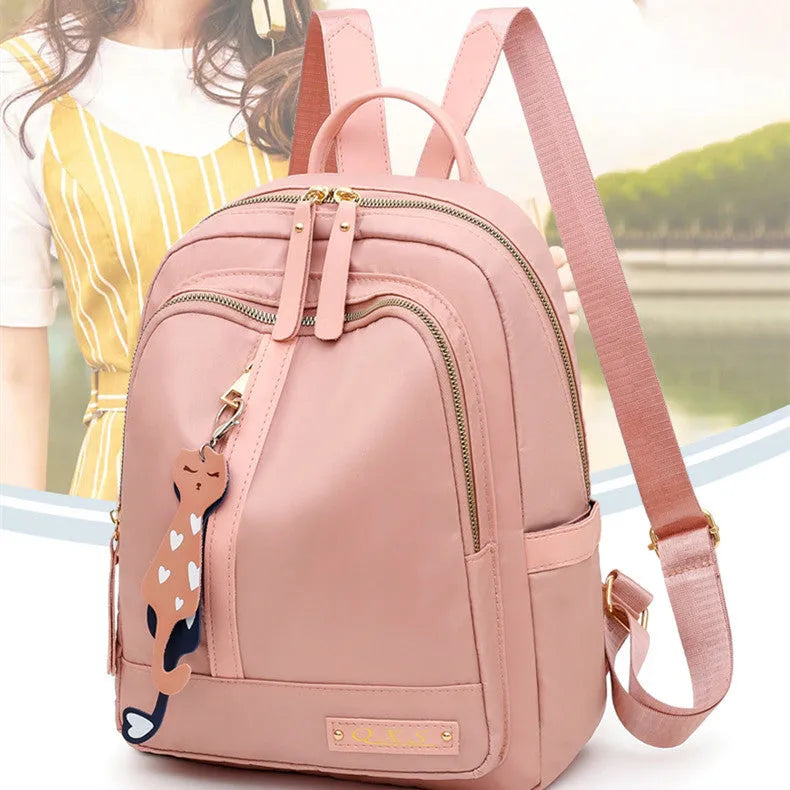 Black or pink casual nylon backpack with waterproof features and organised internal compartments