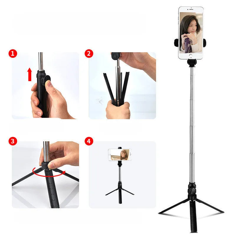 Bluetooth selfie stick tripod with remote control extended, showing adjustable phone clip in black colour.