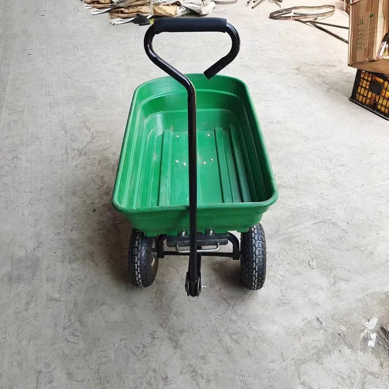 Green four-wheel dumptruck with tipping bed, model TC2145, for garden and farm material transport.