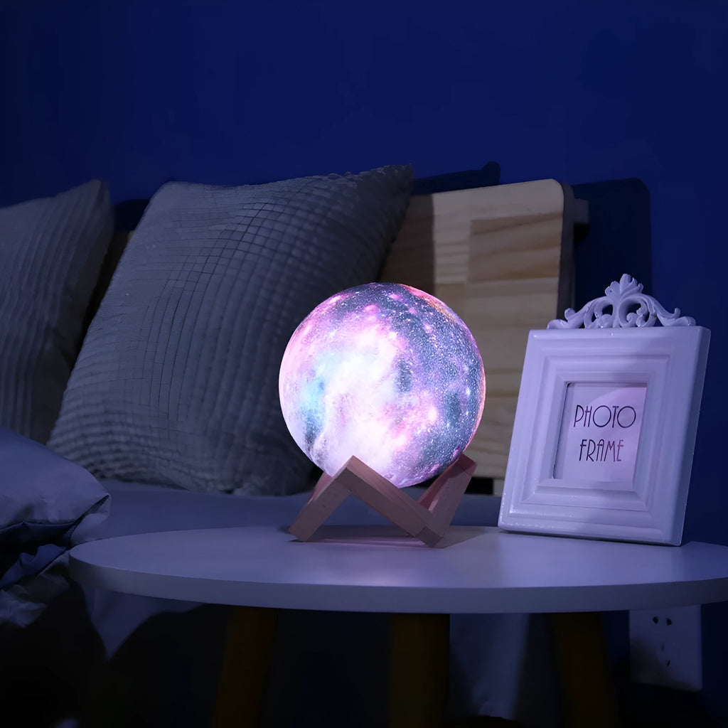 Spherical lunar night light on display, showing colour-changing LED glow with remote control.
