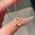 Women's yellow gold copper hollow leaf horse eye pendant necklace with inlaid zircon on adjustable O-ring chain